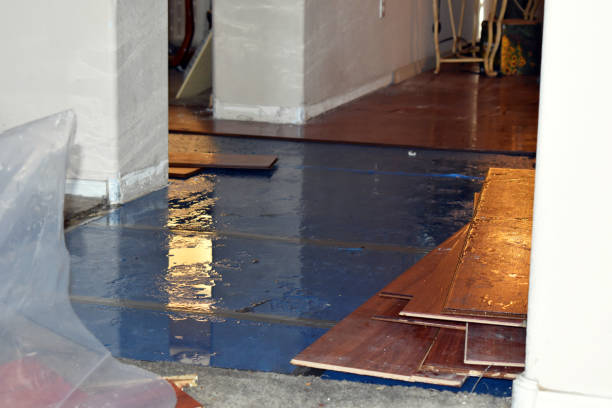 Professional Flood Damage Restoration technician working in Okeechobee, FL